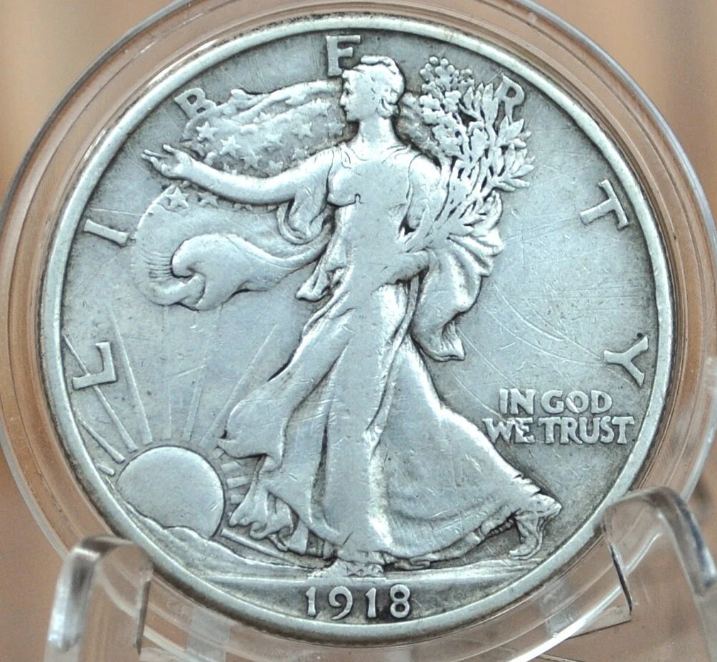 1918 half dollar repunched mint mark error showing secondary D or S impression offset from primary mark under magnification