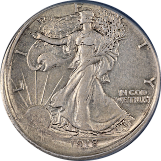 1918 Walking Liberty half dollar off-center strike error showing shifted design and blank crescent area of unstruck metal with visible date
