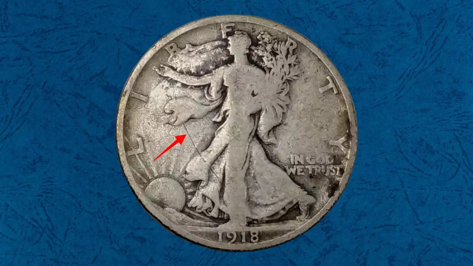 1918 Walking Liberty half dollar die crack error showing raised line across the coin's surface caused by a fractured die